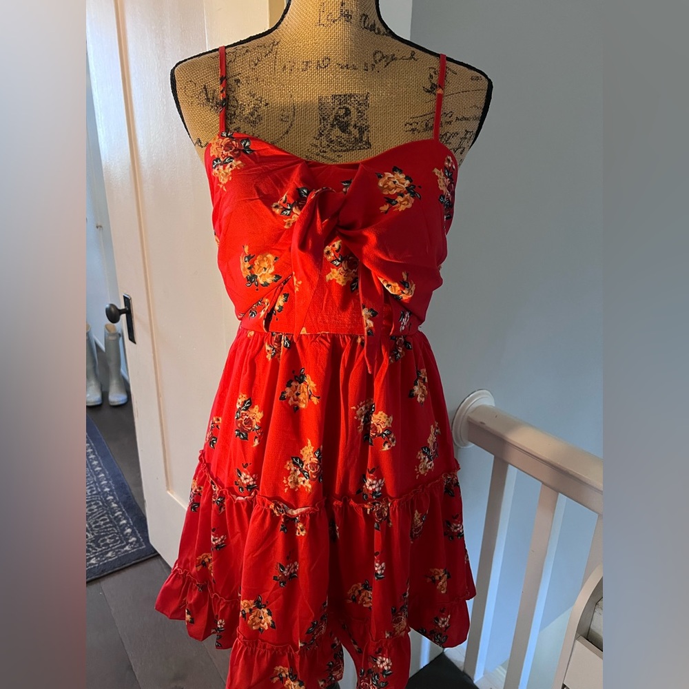 Beautiful red floral dress. Adjustable straps, tie in front, w/ a lining  dress